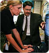 Staff members reviewing data on computer