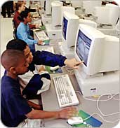 Photo of students working at a computer