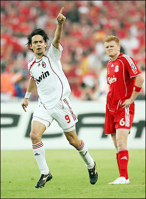 Filippo Inzaghi celebrates an AC Milan goal as defender Jon Arne Riise looks on