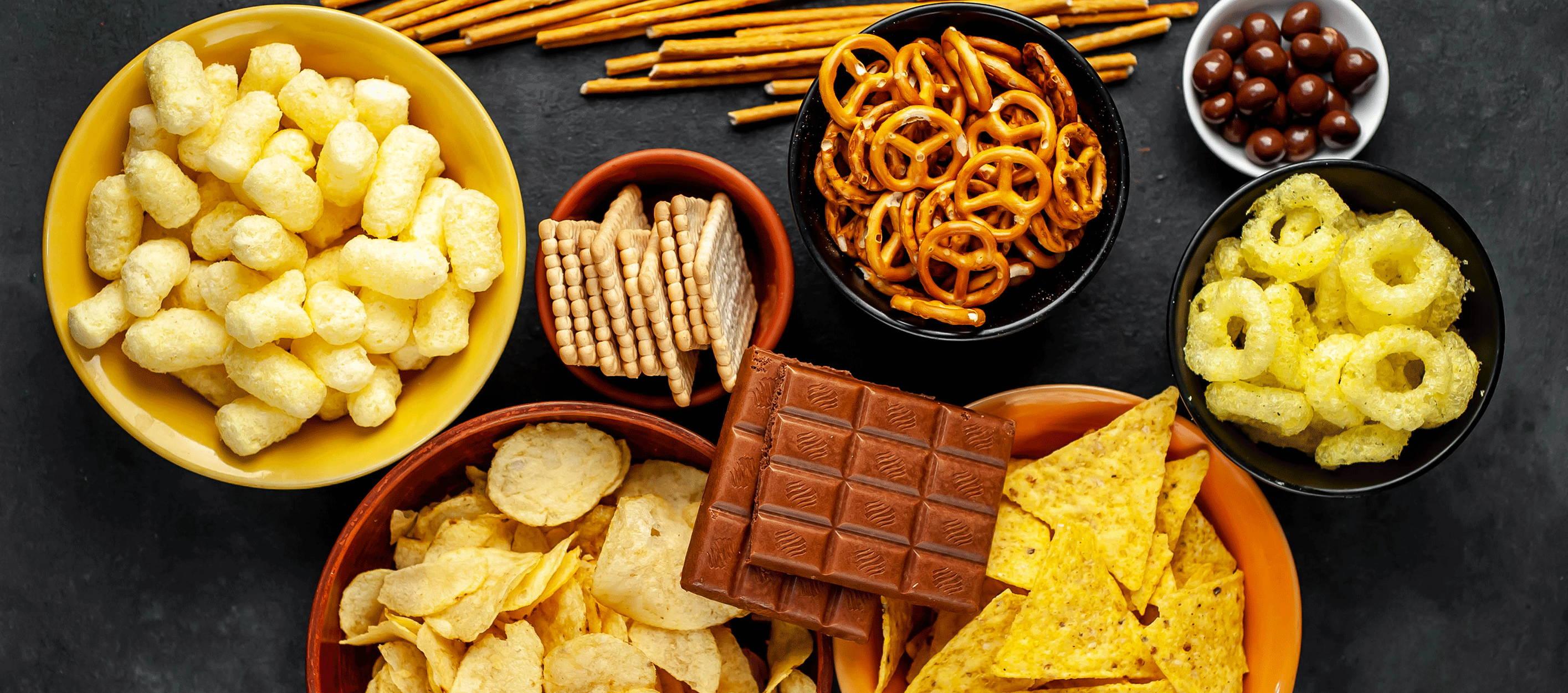 assorted snack foods in bowls