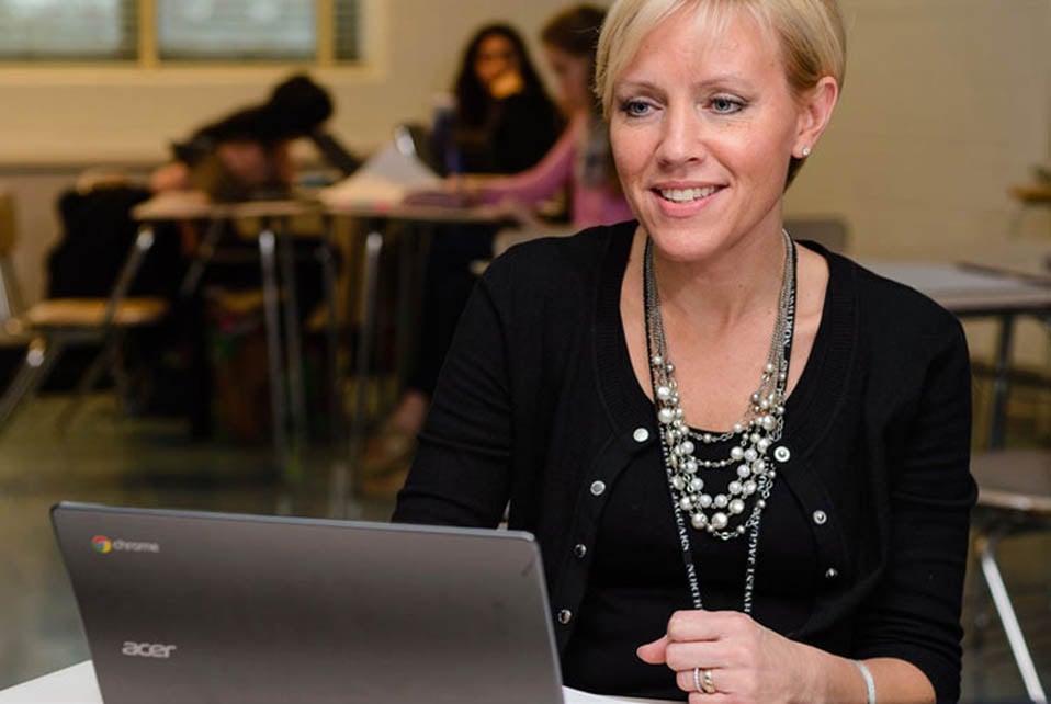 a teacher working with highschool students