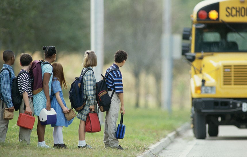 Students waiting at a bus stop