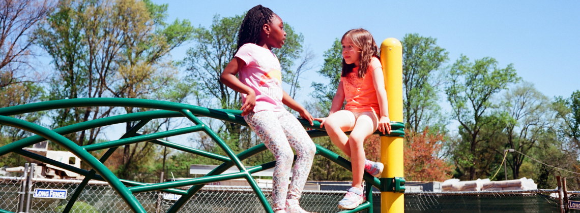 girls climbing carousel 10.png